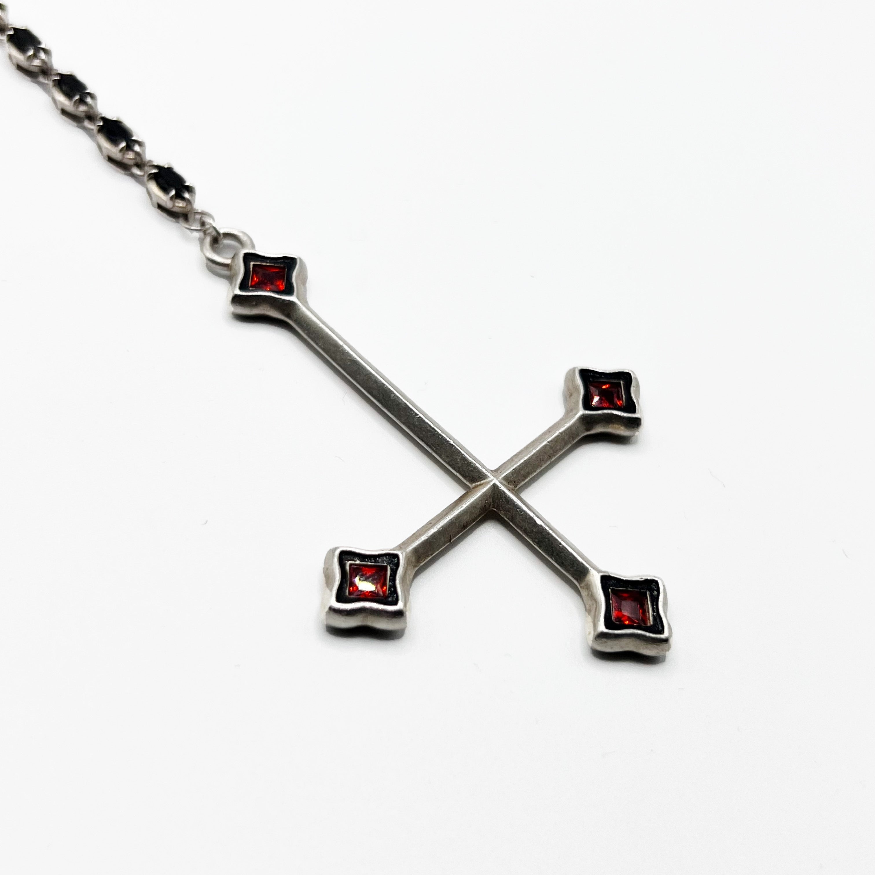 Alucard’s Rosary -A necklace with a cross and red stones.