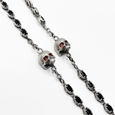 Alucard’s Rosary -A necklace with a cross and red stones.