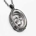 silver necklace with a skull on it