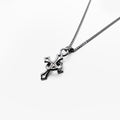 silver cross pendant on a chain