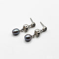 A pair of Silver Skull Head  earrings with black pearls